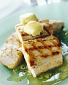 Grilled mahi-mahi fillets with lemon and herb butter