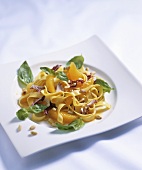 Tagliatelle salad with oranges, radicchio and pine nuts