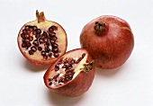 Whole pomegranate and halved pomegranate