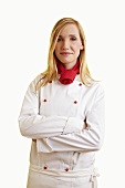Blond female chef in work clothes
