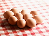 Brown eggs on checked cloth