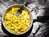 Scrambled egg in a small frying pan
