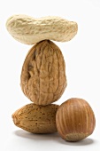 Assorted nuts, some stacked