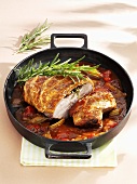 Roast veal with rosemary in a vegetable sauce
