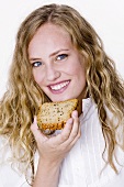 Young woman with a slice of grannary bread
