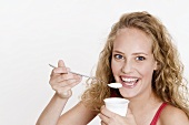 Young woman with natural yoghurt