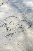 Heart drawn in sand