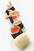 Assorted sushi in a row