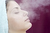 Young woman having steam treatment (spa treatment)