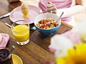 Breakfast with orange juice, muesli and egg