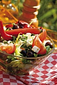 Greek salad on table out of doors