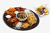Tex-Mex plate: tostadas, meat, dips and spinach sauce