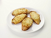 Toasted cheese on baguette slices with garlic