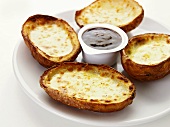 Baked potatoes with cheese and dip
