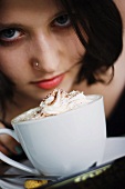 Young woman and cup of hot chocolate