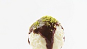 Chocolate with chocolate coating and ground pistachios