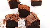 Dusting brownies with cocoa powder