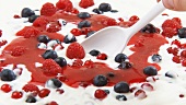 Yoghurt with fresh berries and berry sauce