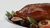 Roast duck with apples and figs