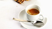 A cup of caffe crema with cookies