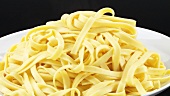Steaming ribbon pasta on a plate