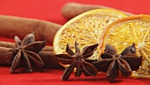 Cinnamon sticks, dried orange slices and star anise