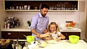 Father and daughter baking together