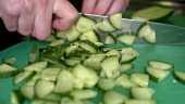 Chopping a cucumber
