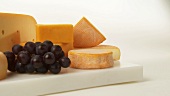 Various cheeses with grapes