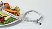 Vegetables and berries with tape measure