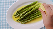 Green asparagus with melted butter and lemon juice