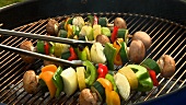 Vegetable kebabs on a barbecue