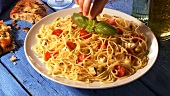 Spaghetti with tomatoes, mozzarella and olives