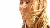 Young woman in wind (portrait)