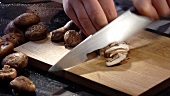 Slicing shiitake mushrooms