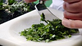 Chopping flat leaf parsley