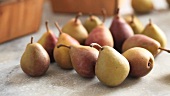 Pears with wooden baskets in the background