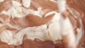 Folding cream into chocolate mixture