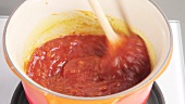 Barbecue sauce being stirred