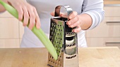 Half a cucumber being grated