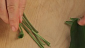 Stems being removed from ramson leaves