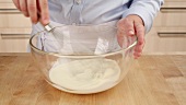 A bowl of cream being whipped