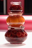Stewed apricot and plum fruit in jar, close-up