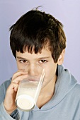 Boy drinking glass of milk