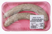 Fresh pork sausages in styrofoam box, elevated view