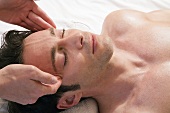 Man receiving facial massage