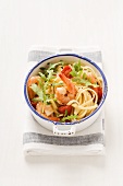 Spaghetti with rocket, cherry tomatoes and prawns