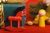 Rocking horse, wooden angel and Christmas gift