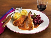Crispy duck with red cabbage and potato dumplings