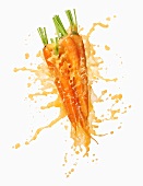 Carrots with splashing carrot juice